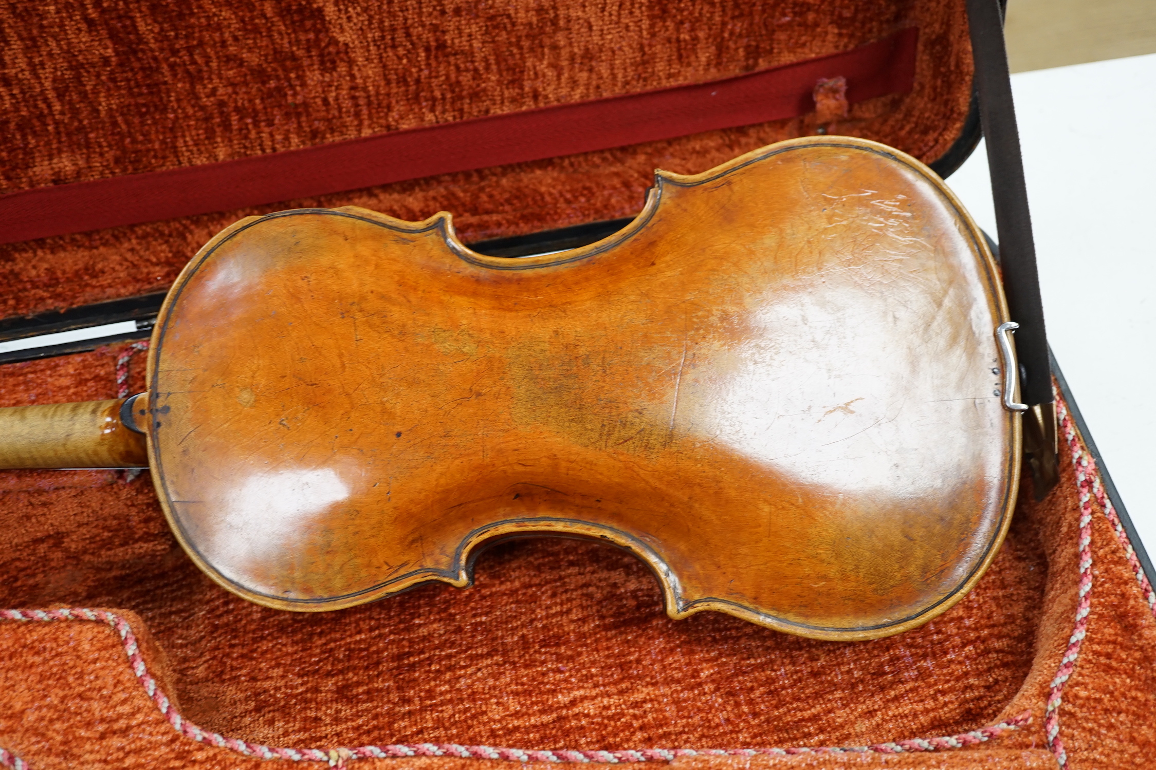 A cased 19th century German viola, length of body 39cm, in a good double case incorporating space for violin, without bow